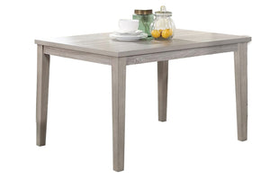 Mesa de comedor gris con algunos elementos sobre un fondo blanco.