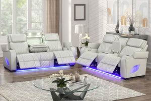 Moderno Juego de Sala con sofá y loveseat reclinable de cuero beige y mesa de centro.