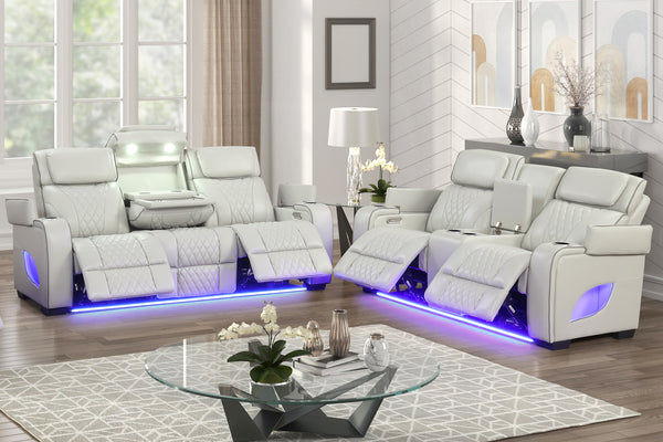 Moderno Juego de Sala con sofá y loveseat reclinable de cuero beige y mesa de centro.