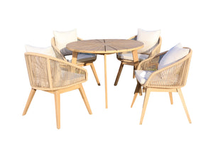 Outdoor furniture set with round table and four wicker chairs on a white background