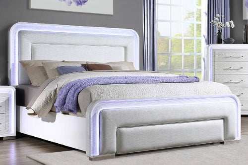 White upholstered bed with LED lights in a bright room setting.