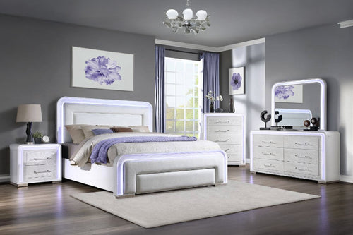 Modern bedroom with white furniture featuring a bed, a dresser with mirror, a chest and a nightstand with LED lights.