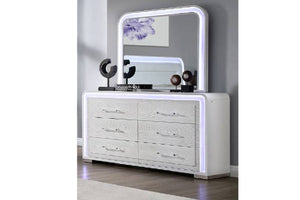 White dresser with mirror with LED lights in an elegant room setting.