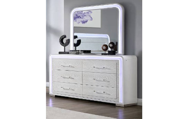 White dresser with mirror with LED lights in an elegant room setting.