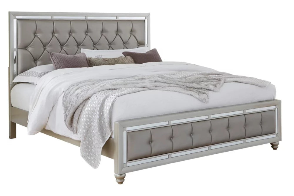 Silver queen bed with tufted headboard and white bedding on a white background.