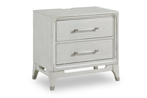 White, textured wood nightstand of two drawers with transparent handles and with a USB port on the back on a white background.
