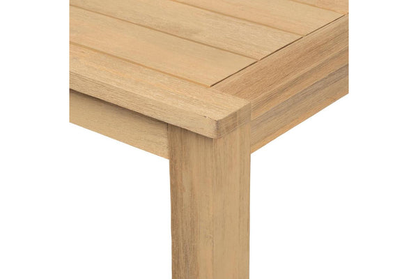 Close-up of a wooden table corner on a white background