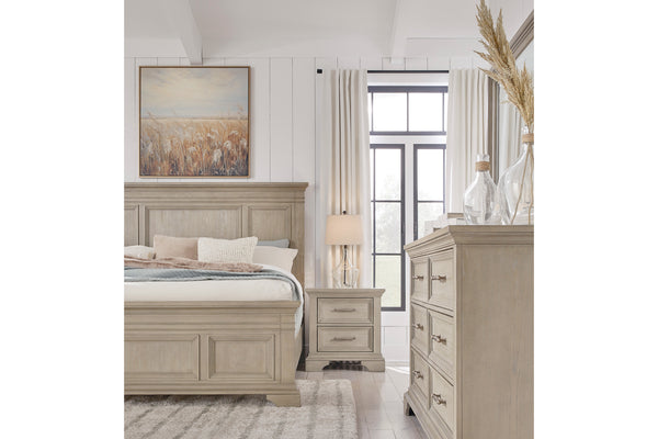 Front view of a portion of the rustic, wooden bedroom set featuring a bed, a nightstand to the right of the bed and the dresser with mirror on the right of the image.