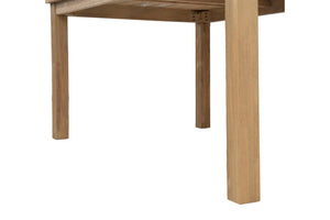 View from below of a rectangular wooden table with legs on a white background.