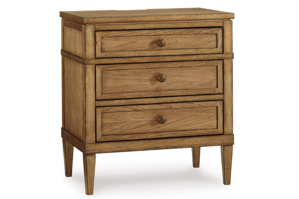 Sideview of wooden nightstand of three drawers on a white background.