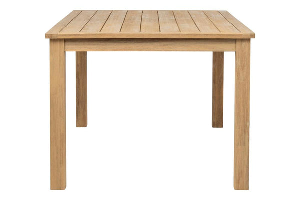 Side view of rectangular wooden table on a white background