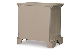 Backside view of beige, wooden nightstand on a white background.