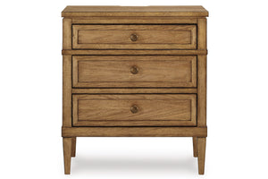 Front view of wooden nightstand with three drawers on a white background.