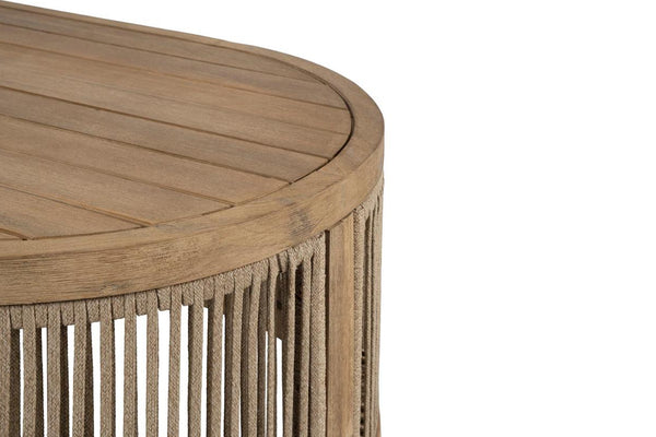 Close up of wooden side table with wicker base on a white background