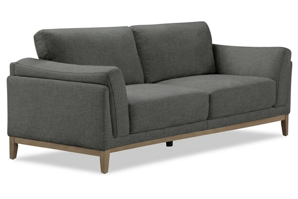 Loveseat gris con patas de madera sobre fondo blanco.