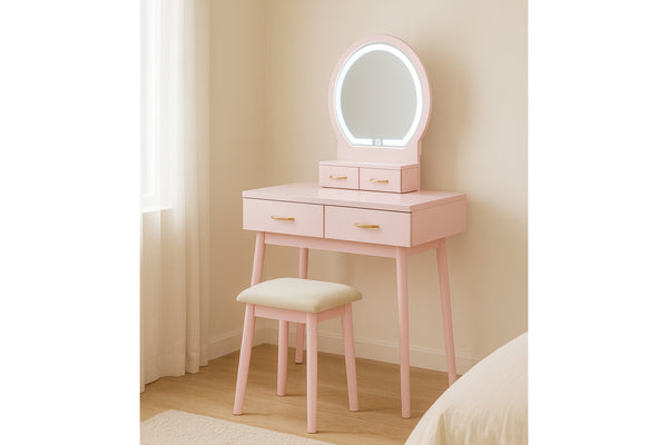 Vanity rosa con espejo redondo y taburete en una habitación.
