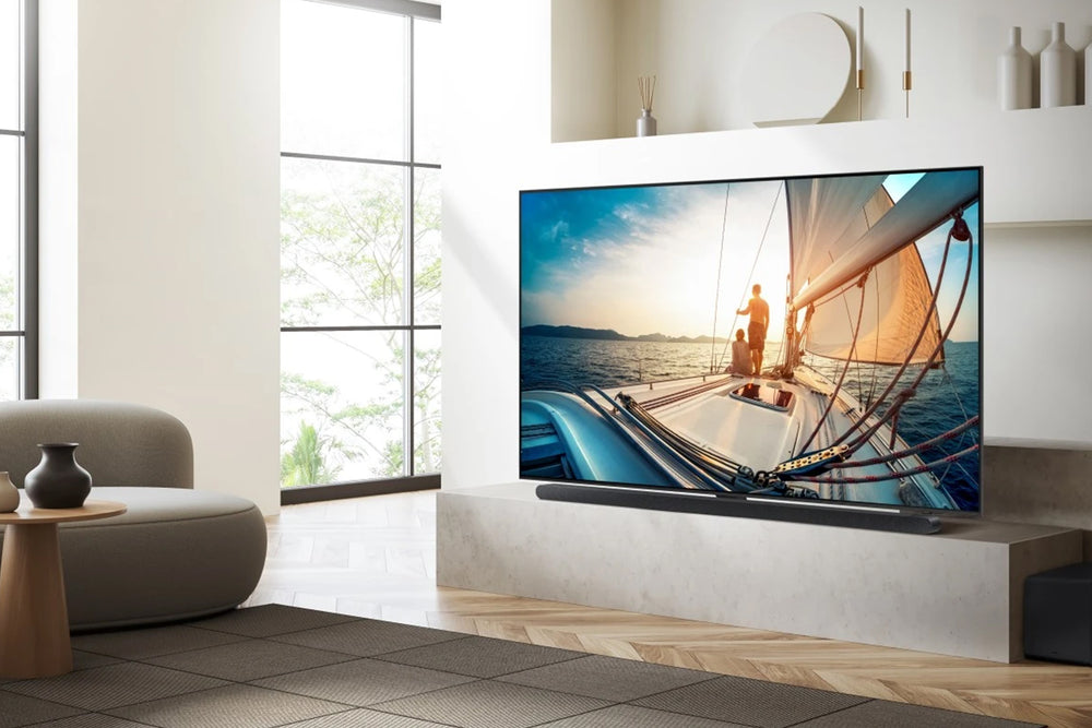 Televisor Samsung Neo QLED con un vibrante diseño abstracto en púrpura y azul en la pantalla.