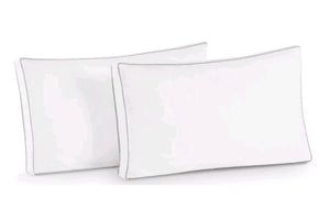Two white pillows on a white background
