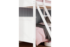 Litera blanca con ropa de cama rosa en una habitación