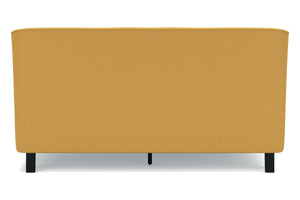 Cama tapizada en color amarillo mostaza con patas negras sobre fondo blanco.
