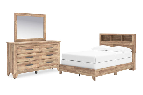 Conjunto de muebles de habitación de madera con cama con estantería en la cabecera, gavetero con espejo sobre fondo blanco.