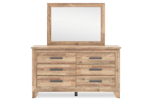 Gavetero de madera con espejo sobre fondo blanco