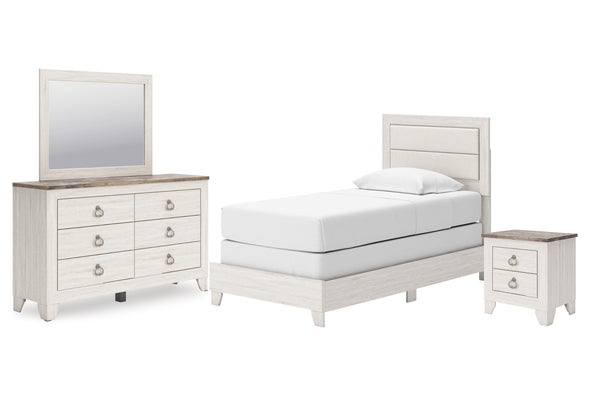 Juego de habitación blanco con cama, gavetero con espejo y mesita de noche sobre fondo blanco.