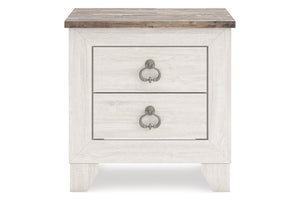 Mesita de noche blanca con dos gavetas y tapa de madera sobre fondo blanco.