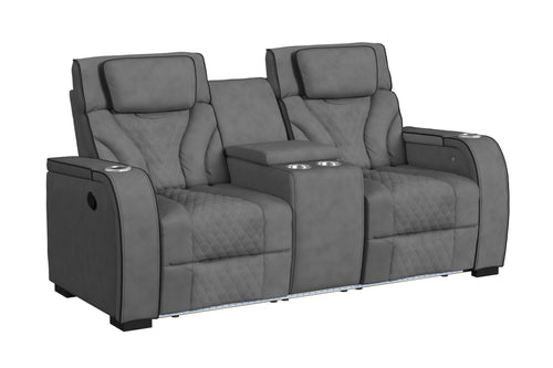 Loveseat reclinable de dos plazas en color gris oscuro, con tapizado acolchado de patrón geométrico, cabeceras ajustables, consola central con portavasos y compartimentos integrados. Diseño moderno con iluminación LED en la base.