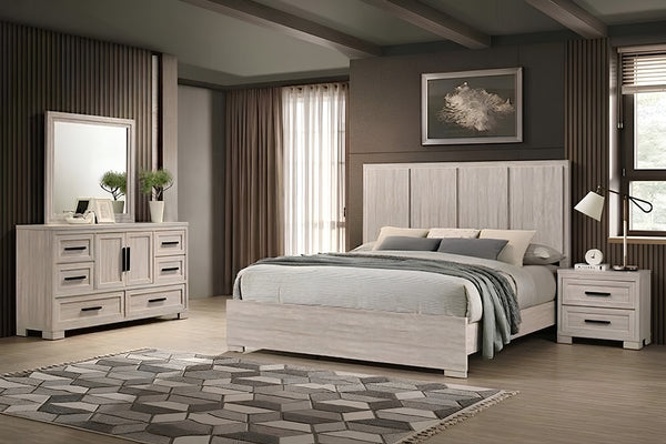 Juego de dormitorio de estilo contemporáneo en acabado de madera gris clara, compuesto por cama con cabecera alta, mesa de noche, gavetero con espejo y gavetero. La habitación incluye ropa de cama neutra, alfombra beige y decoración minimalista.