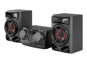 Sistema de audio negro con altavoces sobre fondo blanco.