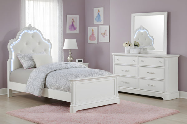 Juego de cuarto de cama twin blanca con luces LED y un gavetero con espejo en una habitación con paredes rosas. 