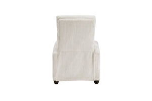 Vista posterior de silla reclinable crema en una sala con elementos decorativos.  