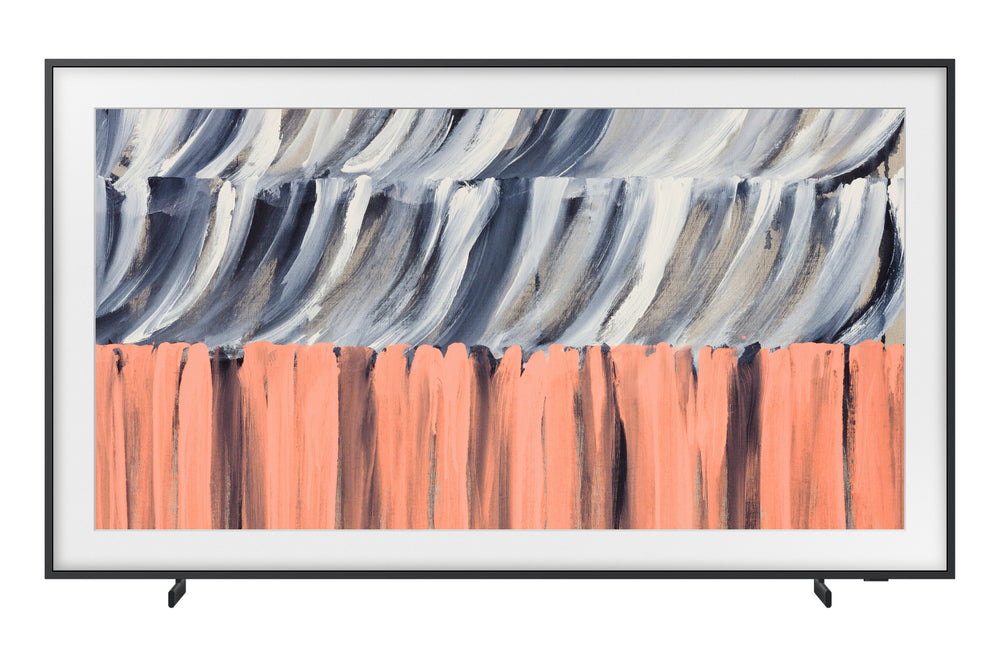 Televisor de pantalla plana con marco negro delgado que muestra una obra de arte abstracta en tonos gris, blanco, negro y coral. Su diseño tipo cuadro permite integrarlo como elemento decorativo en espacios modernos.