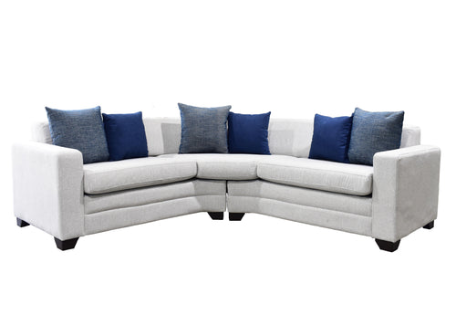 Seccional con cojines azules y grises sobre fondo blanco.