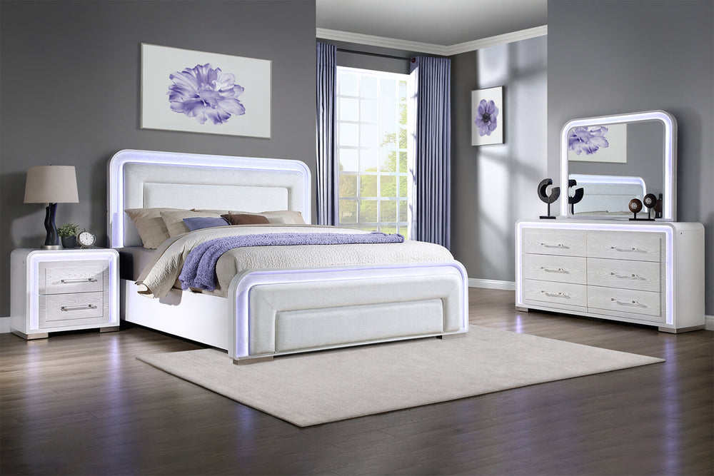 Dormitorio moderno con conjunto de muebles blancos, que incluye cama, mesitas de noche y gavetero con espejo.