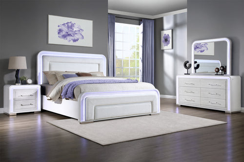 Dormitorio moderno con conjunto de muebles blancos, que incluye cama, mesitas de noche y gavetero con espejo.