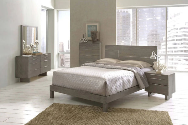 Juego de habitación que incluye una cama, una mesa de noche, un chest y un gavetero con espejo en una habitación moderna. 