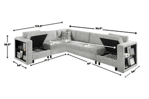Sofá seccional en forma de L tapizado en tela gris clara con compartimentos de almacenamiento integrados en los brazos y asientos elevables. La imagen incluye dimensiones aproximadas de 122.5 pulgadas de ancho, 96.5 pulgadas de largo lateral, 61 pulgadas de profundidad chaise, 34 pulgadas de profundidad de brazos y 28.5 pulgadas de altura.