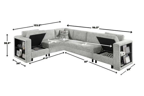 Sofá seccional en forma de L tapizado en tela gris clara con compartimentos de almacenamiento integrados en los brazos y asientos elevables. La imagen incluye dimensiones aproximadas de 122.5 pulgadas de ancho, 96.5 pulgadas de largo lateral, 61 pulgadas de profundidad chaise, 34 pulgadas de profundidad de brazos y 28.5 pulgadas de altura.