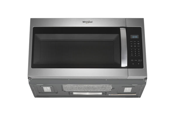 Microondas con Extractor Whirlpool de acero inoxidable sobre fondo blanco