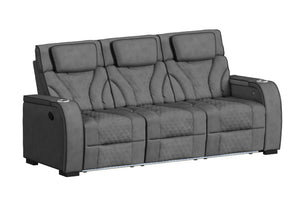 Sofá reclinable de tres plazas en color gris oscuro, visto en ángulo. Cuenta con respaldos altos acolchados, tapizado con patrón de rombos, apoyabrazos amplios con portavasos integrados e iluminación LED en la base para un estilo modern