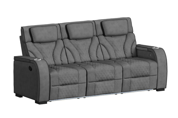 Sofá reclinable de tres plazas en color gris oscuro, visto en ángulo. Cuenta con respaldos altos acolchados, tapizado con patrón de rombos, apoyabrazos amplios con portavasos integrados e iluminación LED en la base para un estilo modern