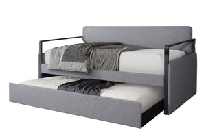 Cama nido extraíble tapizada en color gris sobre fondo blanco.