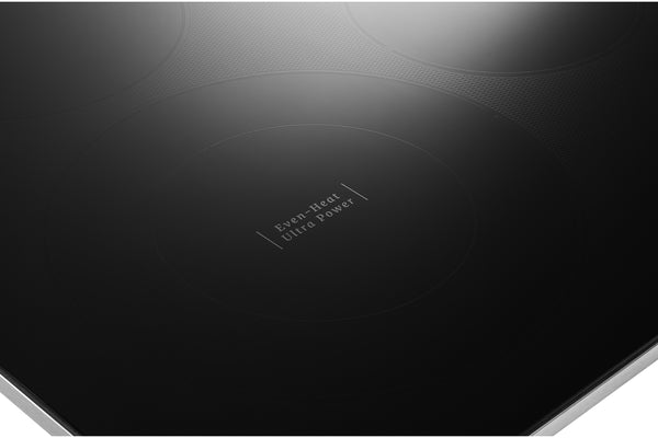 Tope de cocina negra con la marca 'Even-Heat Ultra Power' sobre fondo blanco.