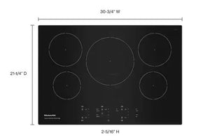 Cubierta de inducción KitchenAid de 30.75 pulgadas con superficie de vidrio negro, cinco zonas de cocción y controles táctiles frontales. La imagen incluye dimensiones de 30.75 pulgadas de ancho, 21.25 pulgadas de profundidad y 2.31 pulgadas de altura.