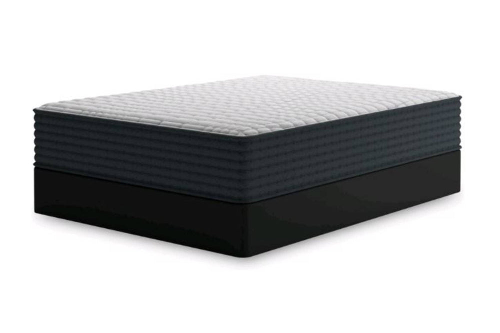 Un mattress de gran tamaño sobre una base oscura, mostrado desde una perspectiva de tres cuartos contra un fondo blanco liso.