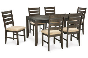 Juego de mesa de comedor con seis sillas sobre fondo blanco.
