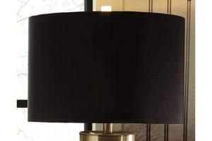 Pantalla de lámpara negra sobre un fondo borroso. 