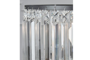 Pantalla de lámpara de cristal con dibujos de estrellas sobre fondo blanco.